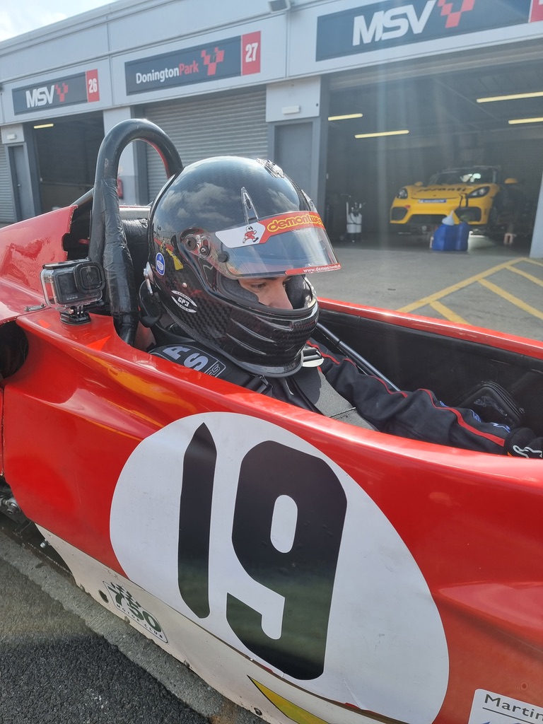 In the cockpit, helmet on